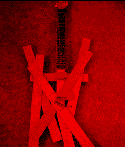 electric guitar with really badly put together body of wooden slabs jutting out every which way
