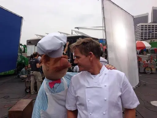 Gordon Ramsay locking eyes passionately with the Swedish Chef from the Muppets