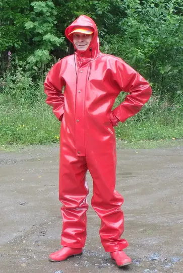 generic white man smiling while showing off red onesie raincoat